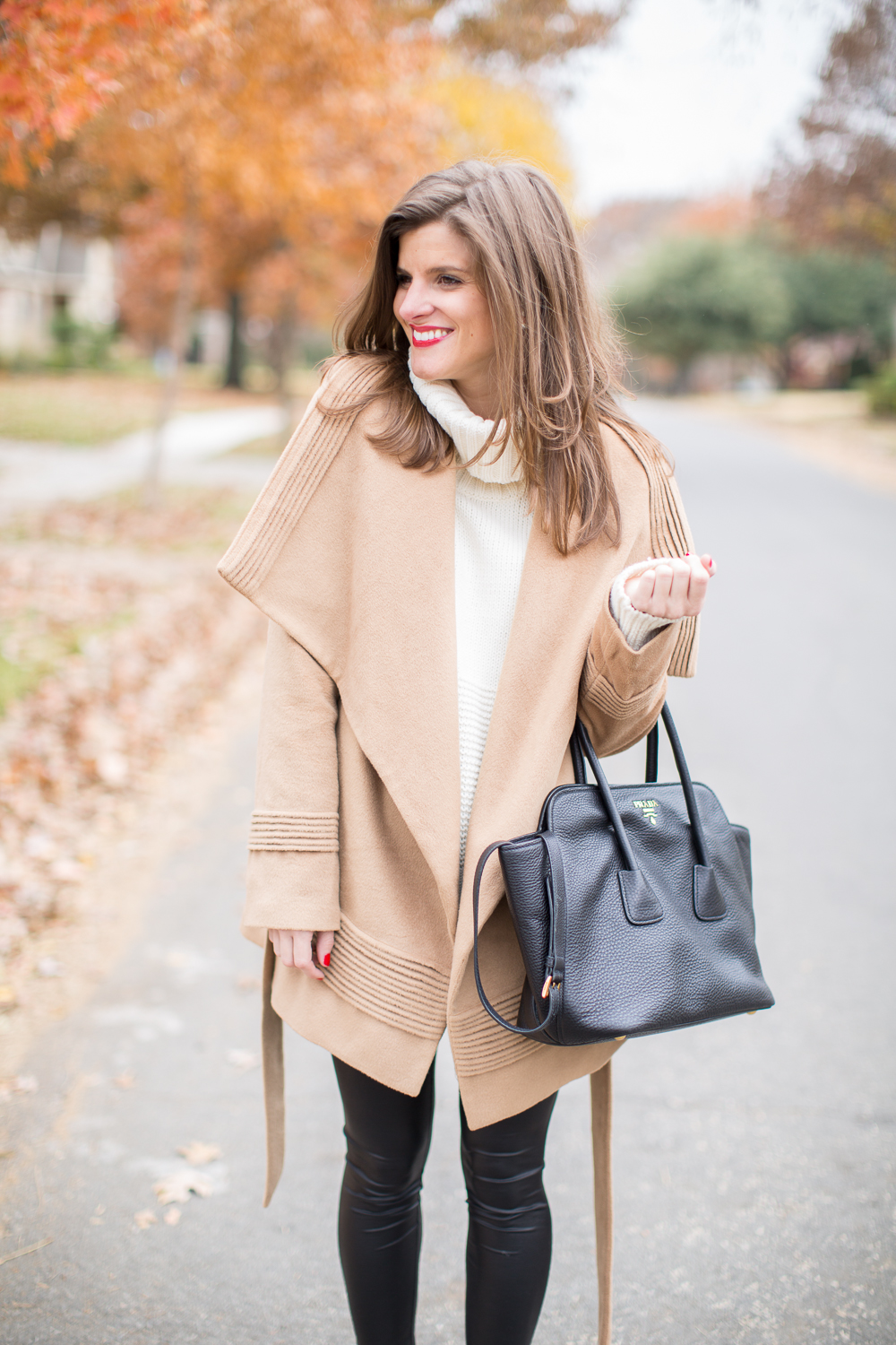 Winter Outfit: faux leather leggings, camel coat, cream turtleneck, pony hair pumps