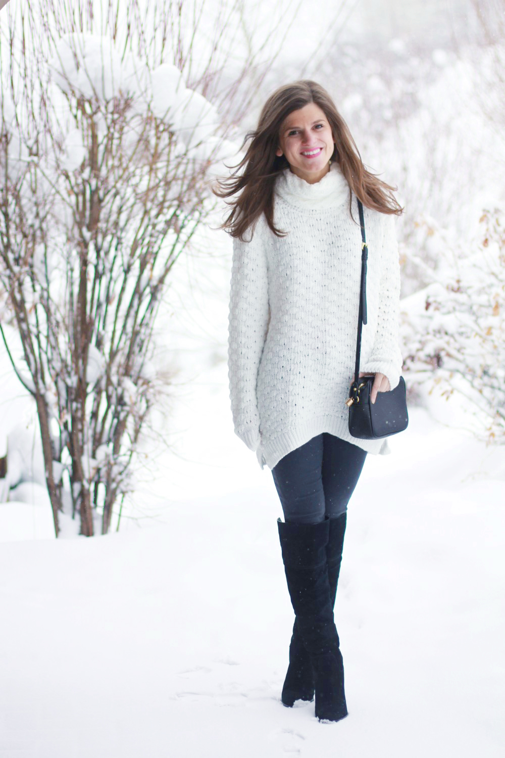 long white turtleneck sweater, dark grey pants, tall black boots winter snow outfit