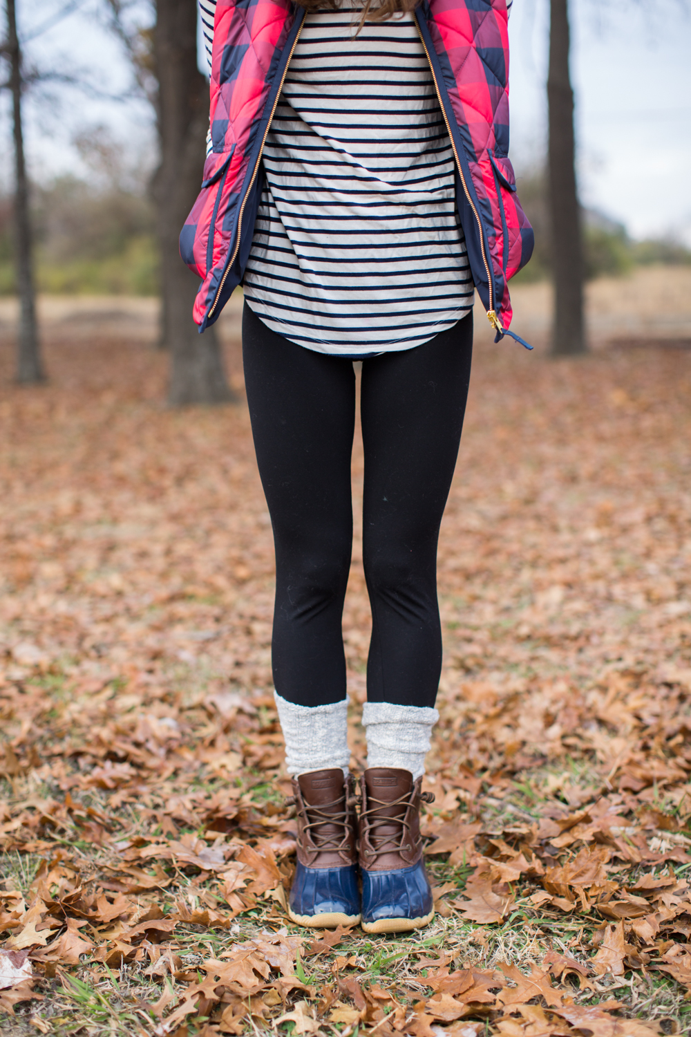 buffalo check puffer vest striped turtleneck scrunchy socks duck boots fall outfit