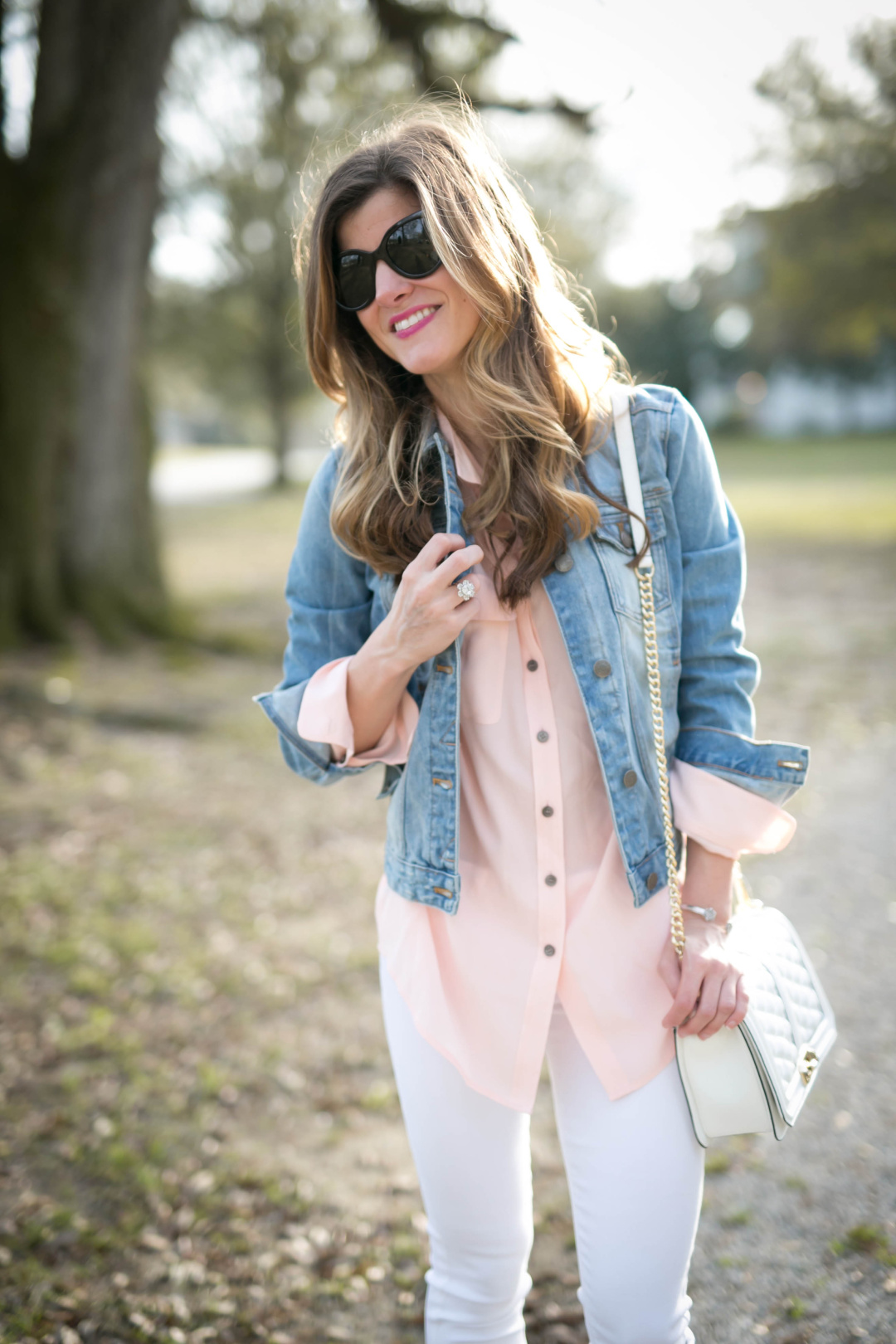 silk pink shirt, light was denim jacket, white jeans outfit