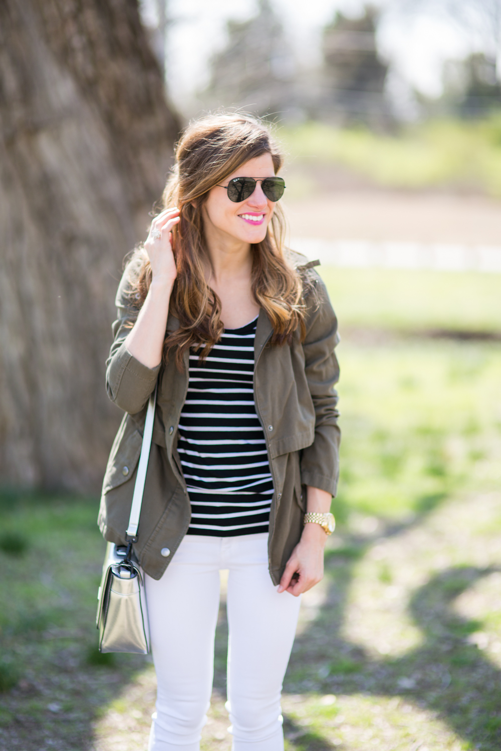 all black ray ban aviators, black and white striped tee, white jeans, utility jacket