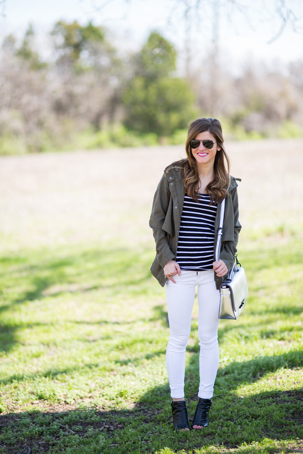 white jeans outfit - black peep toe booties, black and white striped tee, olive green military jacket, transitional outfit idea, fall outfit idea