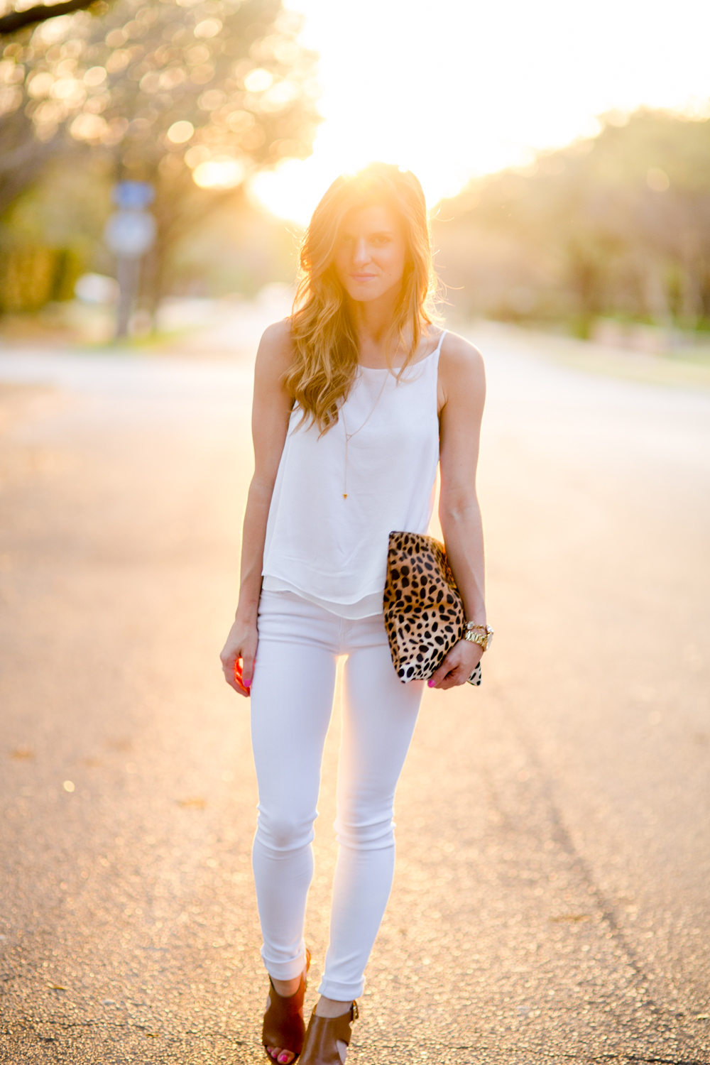 all white outfit with white tank, white jeans, cognac wedges, leopard clutch summer outfit