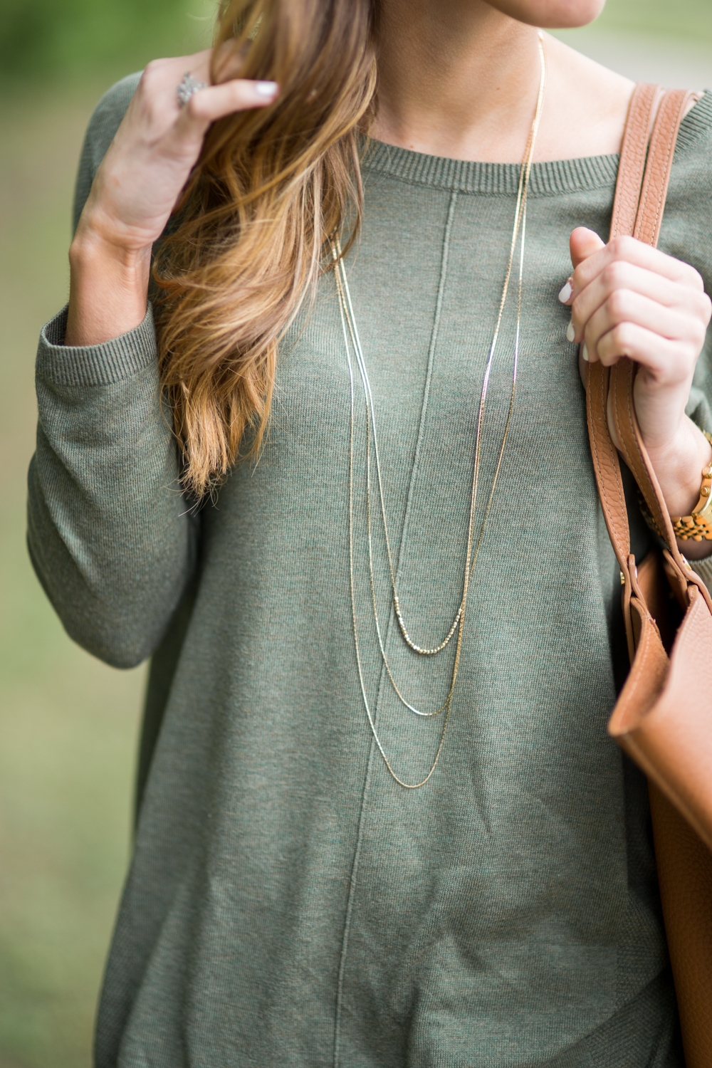 olive green topshop sweater with delicate gold layered nekclaces