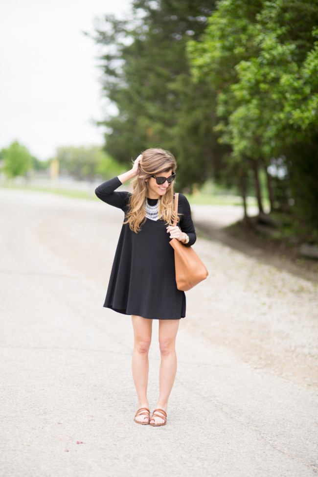 black long sleeve swing dress with statement necklace and sandals transitional outfit