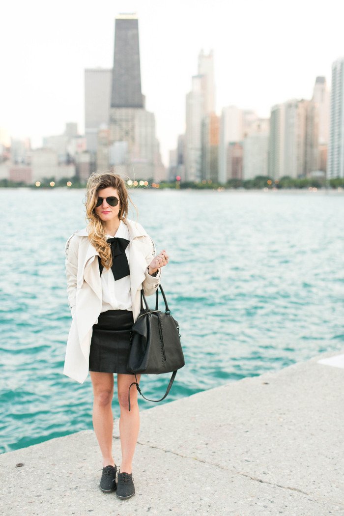 leather mini skirt and oxfords with trench coat and black bow tie