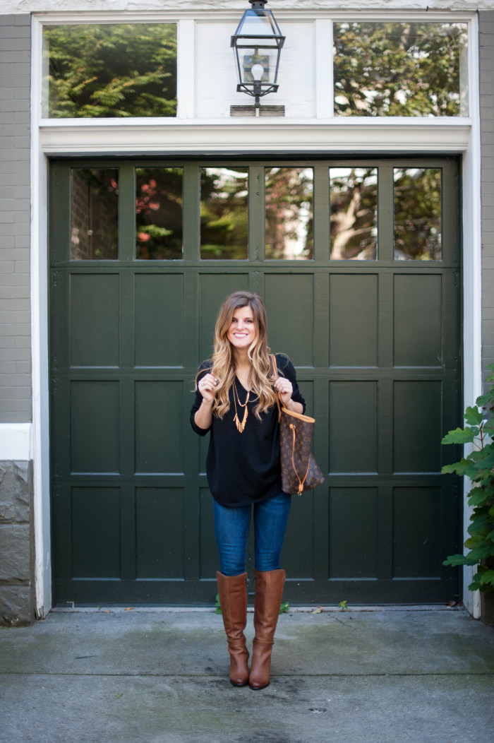 black sweater with gold necklace and brown boots