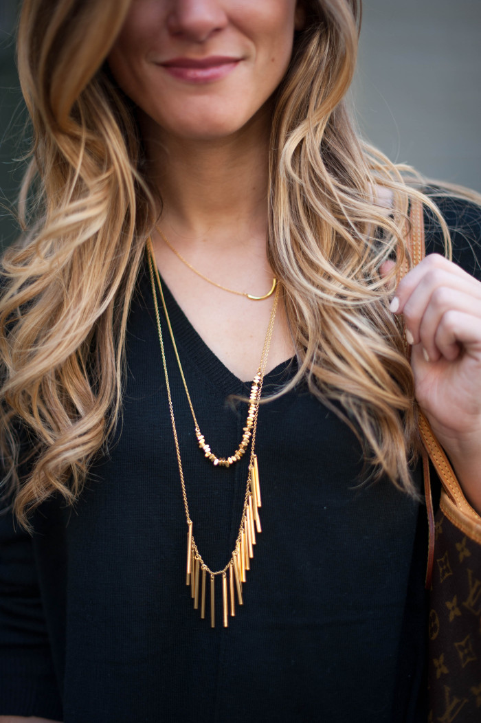 Baublebar gold rush layered necklace over black sweater