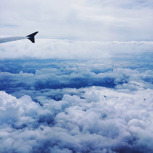 Clouds through plane window