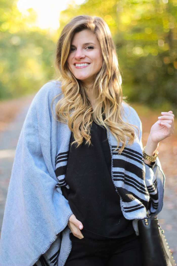 grey poncho and black turtleneck outfit