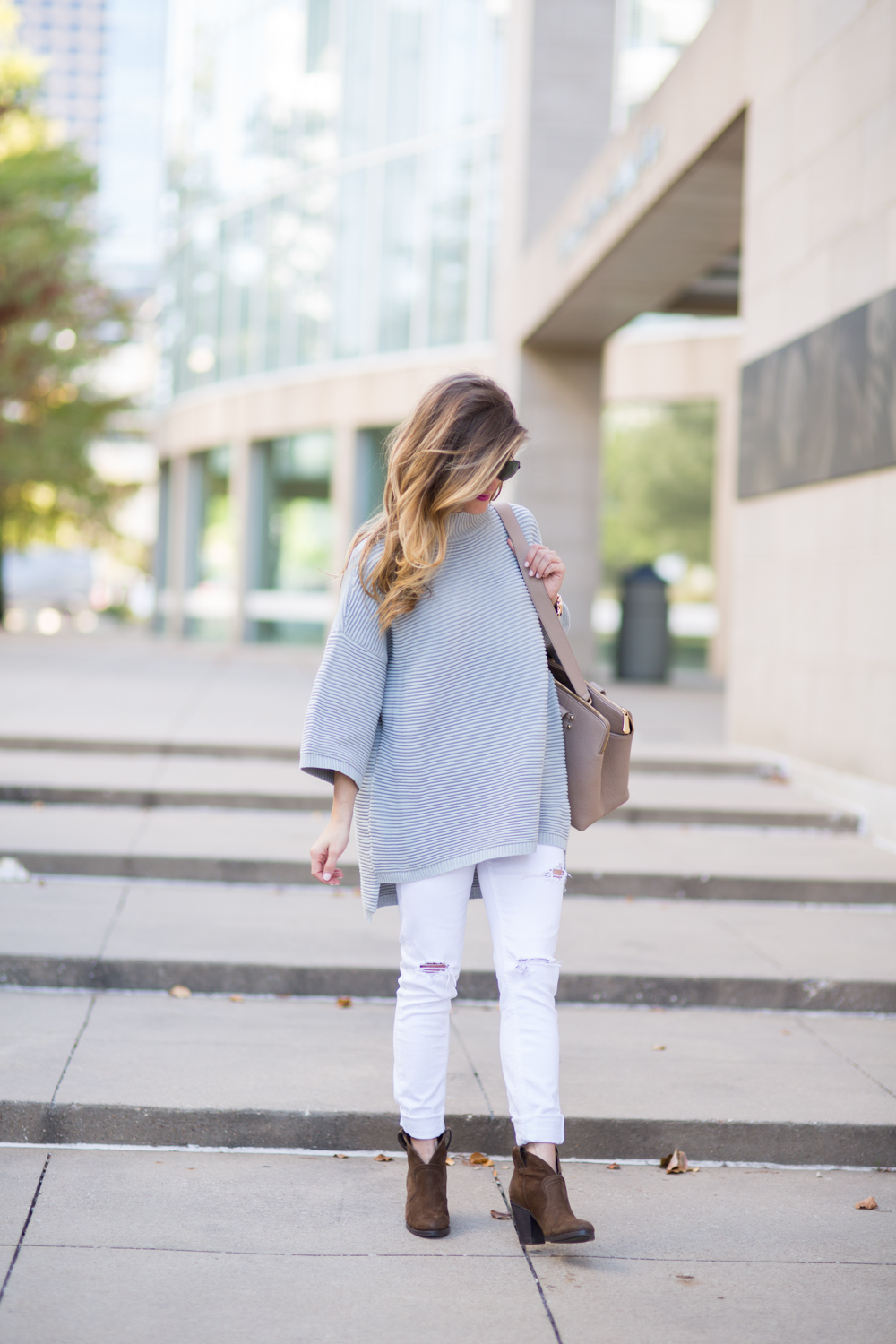 oversized grey sweater + white jeans + brown ankle booties