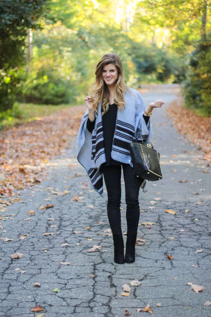 Grey Poncho over All Black Outfit with black booties and black stud valentino bag