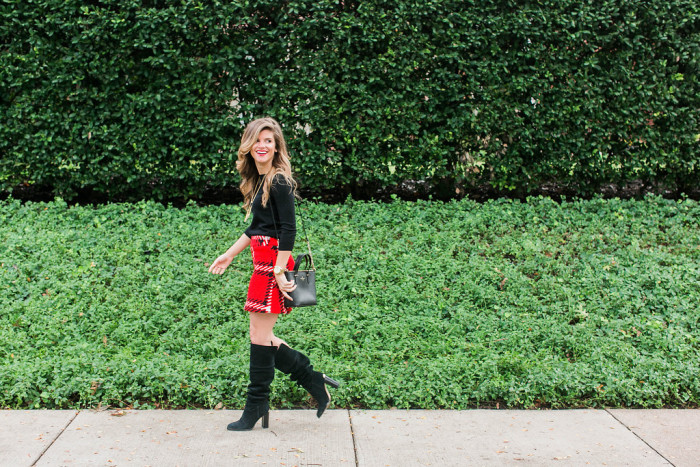 Red black plaid mini skirt with black sweater holiday outfit