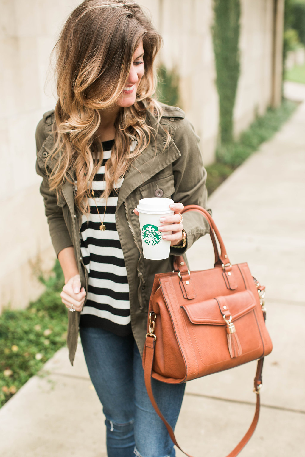 how to wear an olive green military jacket cute fall outfit idea with black and white stripes and brown suede booties