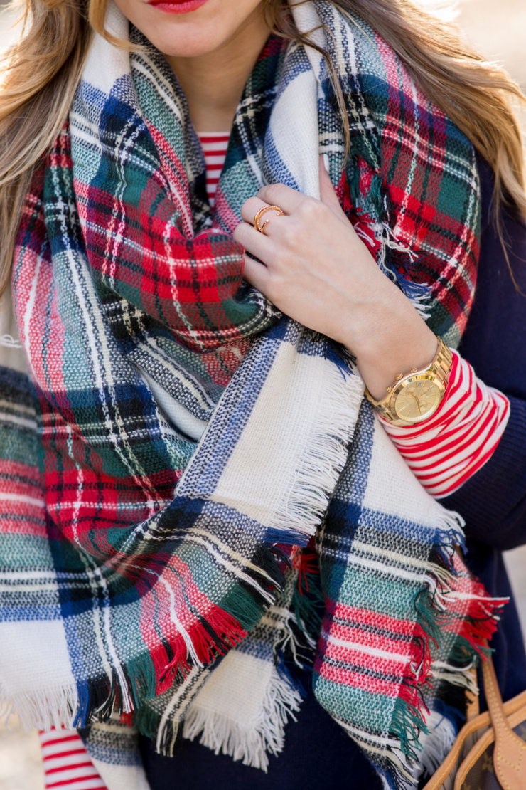 Festive plaid scarf outfit with stripes and layers for holiday season
