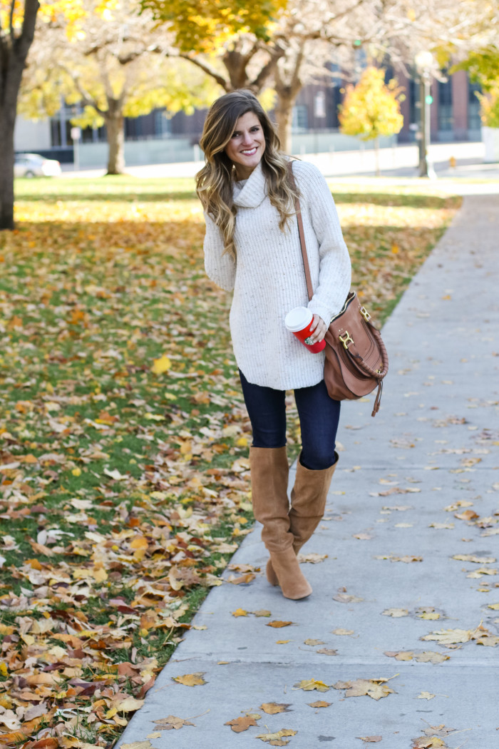 cream turtleneck sweater tan suede tall boots and jeans fall outfit
