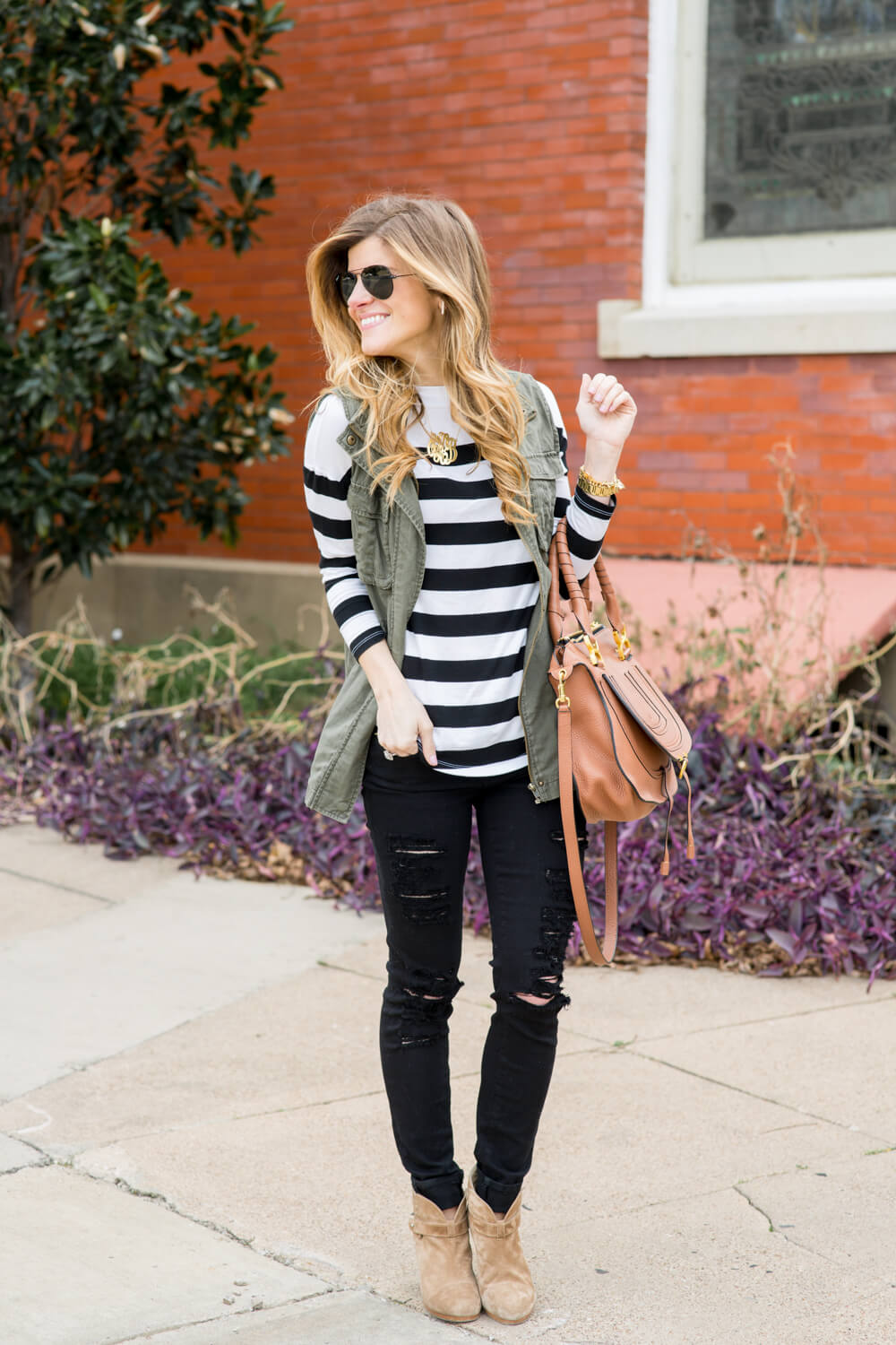 utility vest + striped long sleeve tee + distressed jeans