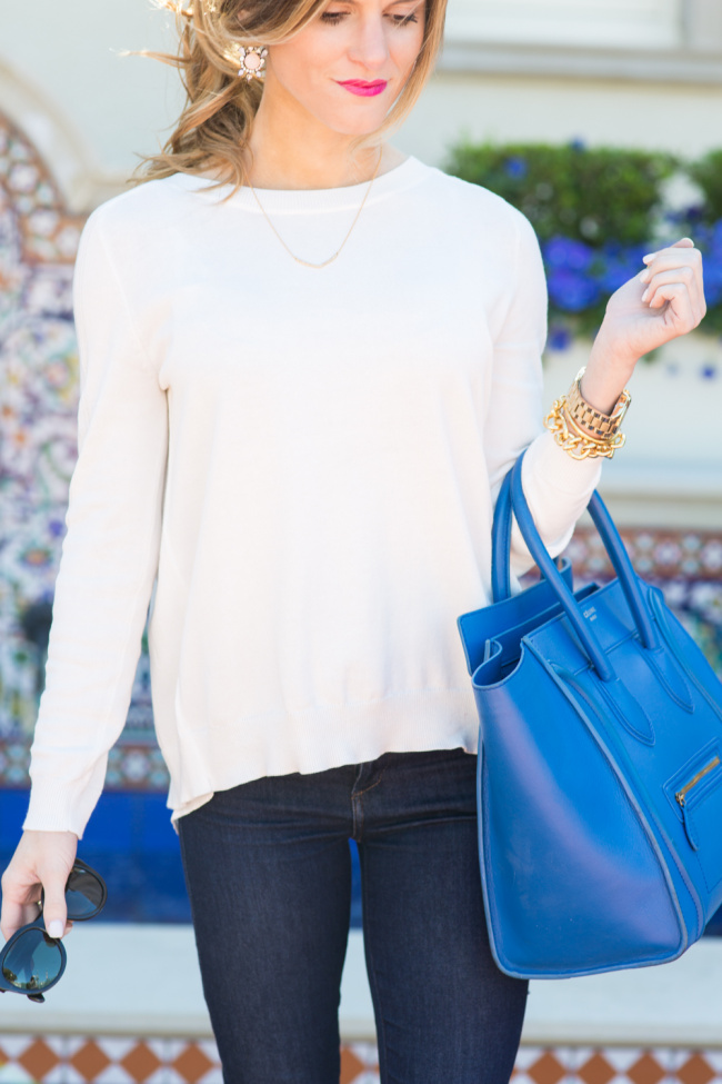 Brighton the day cream sweater and dark jeans outfit with bright blue celine 