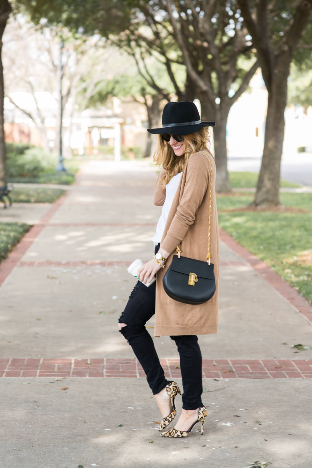 long camel cardigan, white tee, black ripped jeans, aviators, black chloe drew bag, black floppy hat, leopard heels, dressy black jeans outfit, transitional fall outfit, dressing up a white t-shirt, fall neutrals