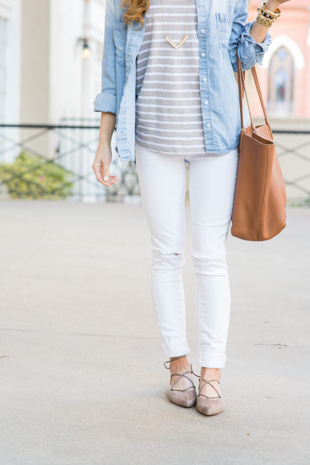 brighton the day wearing white jeans with stuart weitzman lace up flats in taupe suede