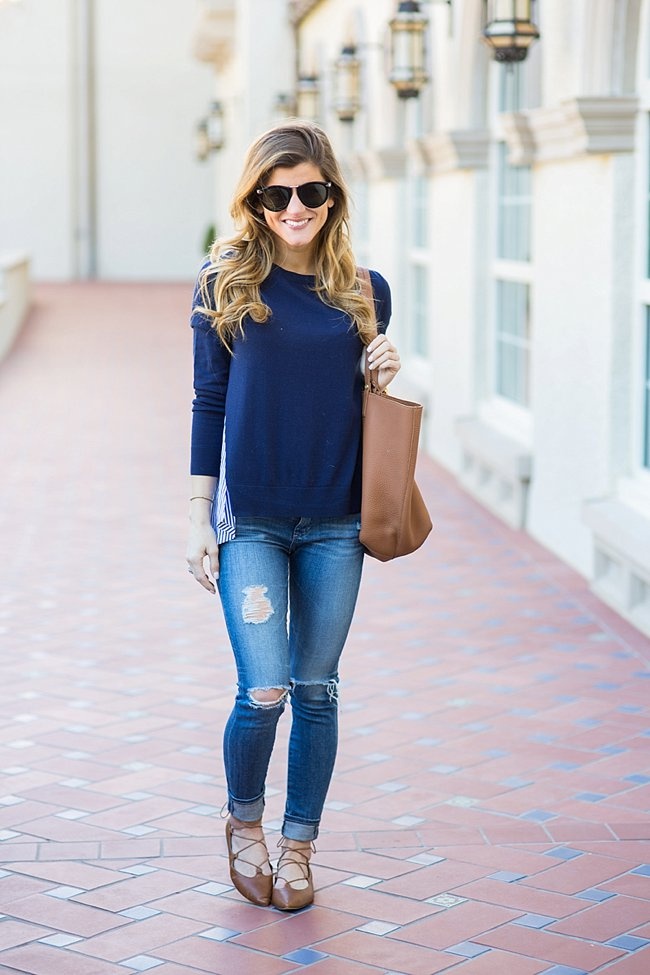 Brighton the day seen wearing blue striped back sweater with ag jeans and tan lace flats and karen walker sunglasses