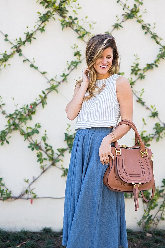 brightontheday wearing flowy midi skirt with linen striped crop top and chloe tan marcie bag