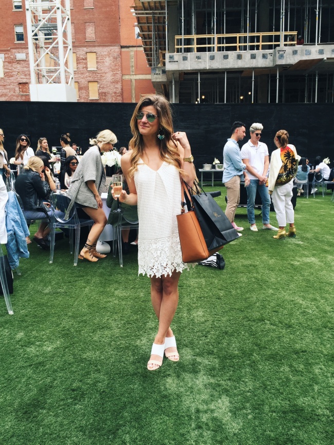 @brightonkeller's outfit for luisaviaroma party at rsthecon with white lace dress and denim jacket