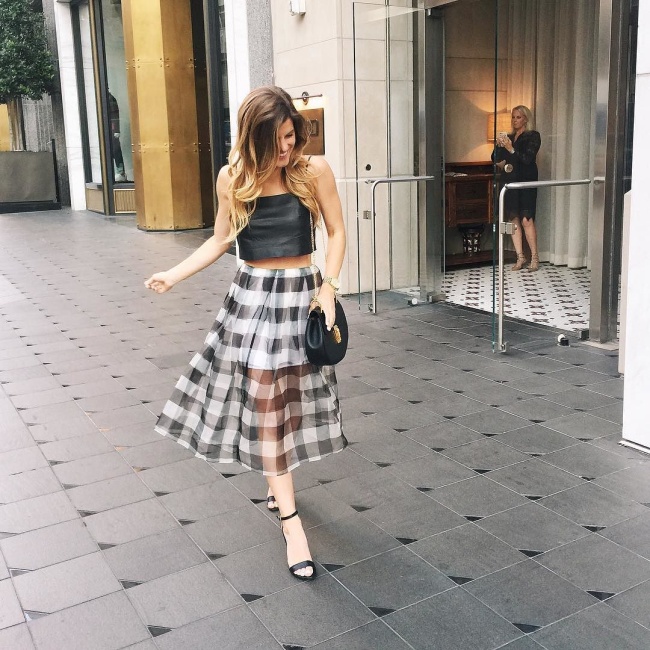 brighton the day wearing kendall and kylie outfit with gingham midi skirt and leather crop top
