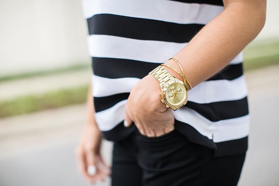 brightontheday wearing michael kors gold runway watch paired with gorjana criss cross hammered gold cuff detail shot