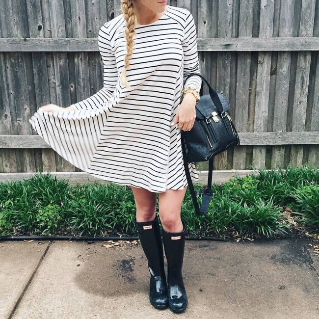 what to wear on a rainy day - rainy day outfits and ideas - black and white striped swing dress with black glossy hunter boots