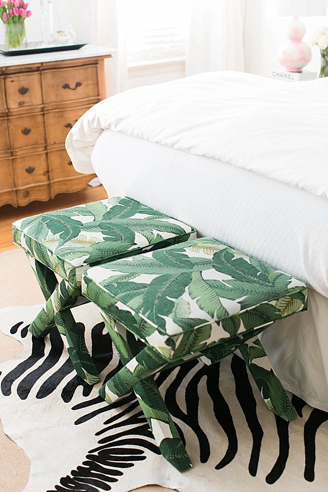 brighton keller bedroom palm leaf print x bench at foot of bed over zebra hide rug