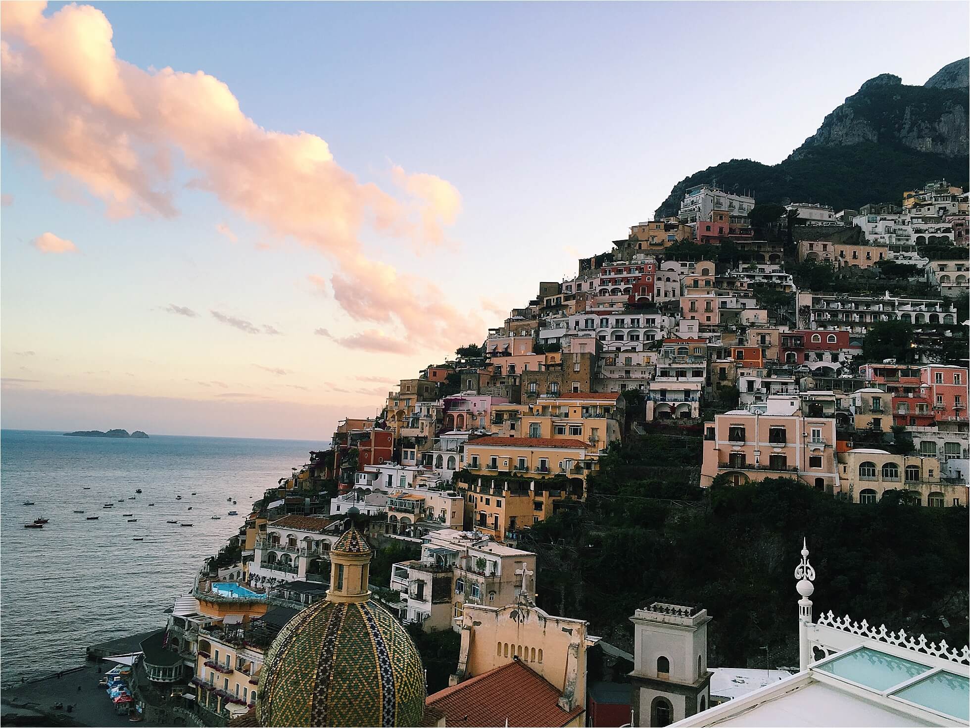 view from hotel le sirenuse champagne bar in positano // best places to grab a glass of wine with a view via brighton the day blog