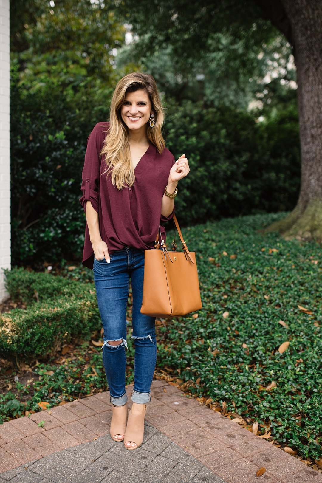 transition from summer to fall cute outfit idea with peep toe booties and versatile burgundy blouse