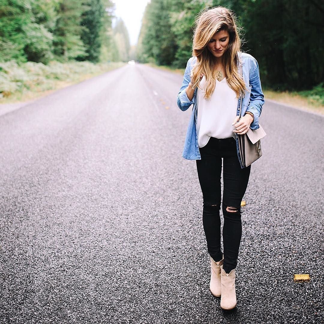 brighton keller wearing chambray shirt and black distressed jeans 