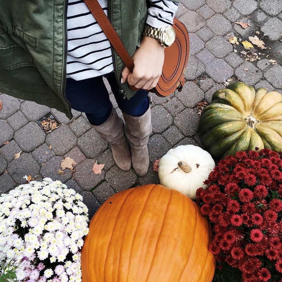 selfie of tall boots, utility jacket, striped tee and pumpkins for fall