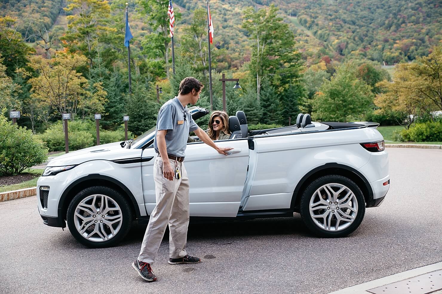 pulling up to stowe mountain lodge in Land Rover evoque convertible
