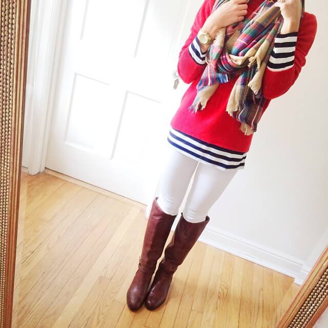 white jeans outfit, red sweater layered over striped long sleeve tee, riding boots, blanket scarf