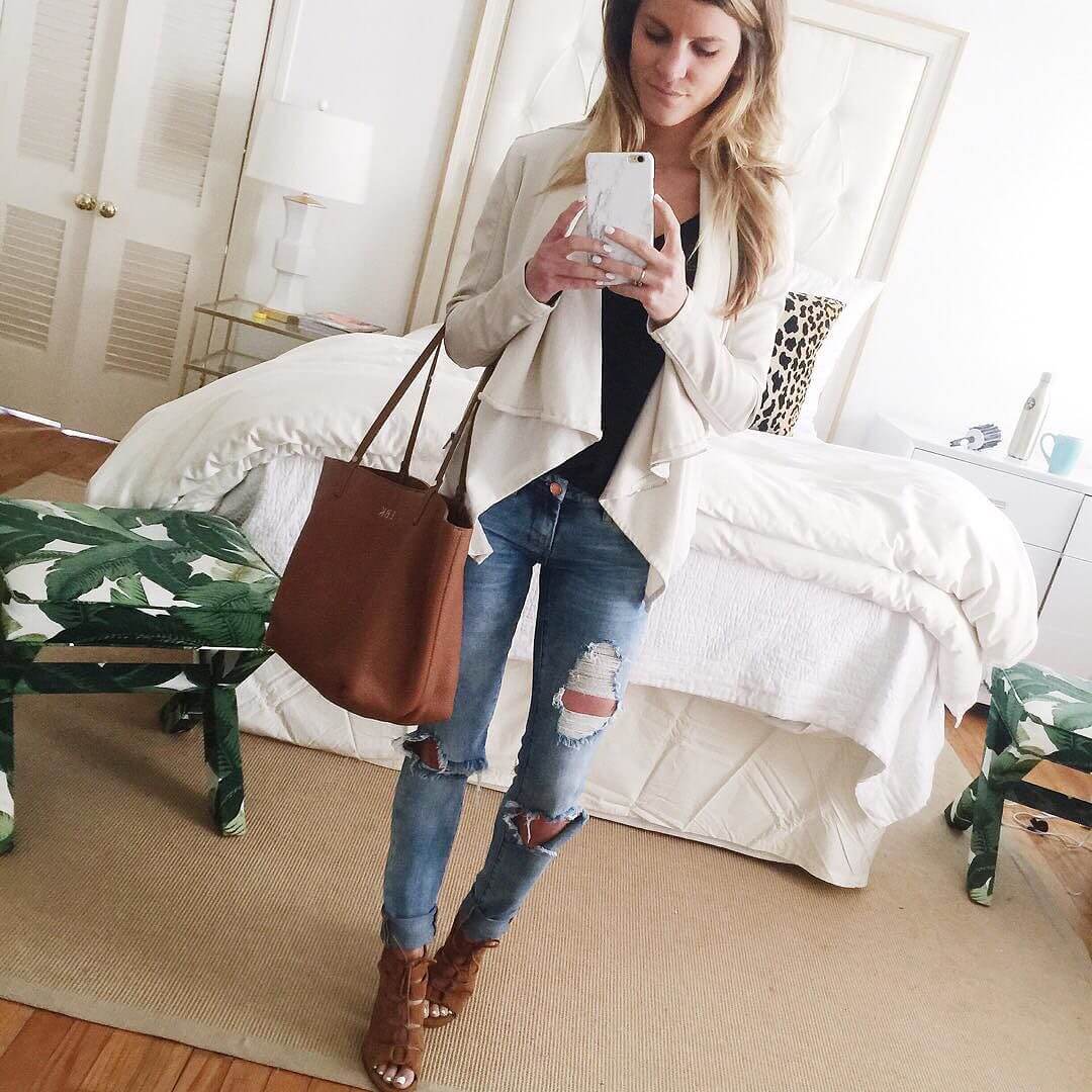 white leather jacket and distressed jeans with open toe booties