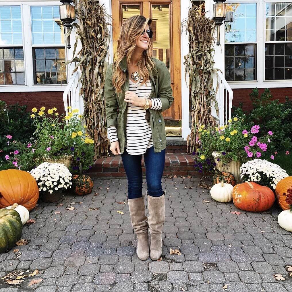 brighton the day wearing jeans, utility jacket, grey boots, stripe shirt at pumpkin patch