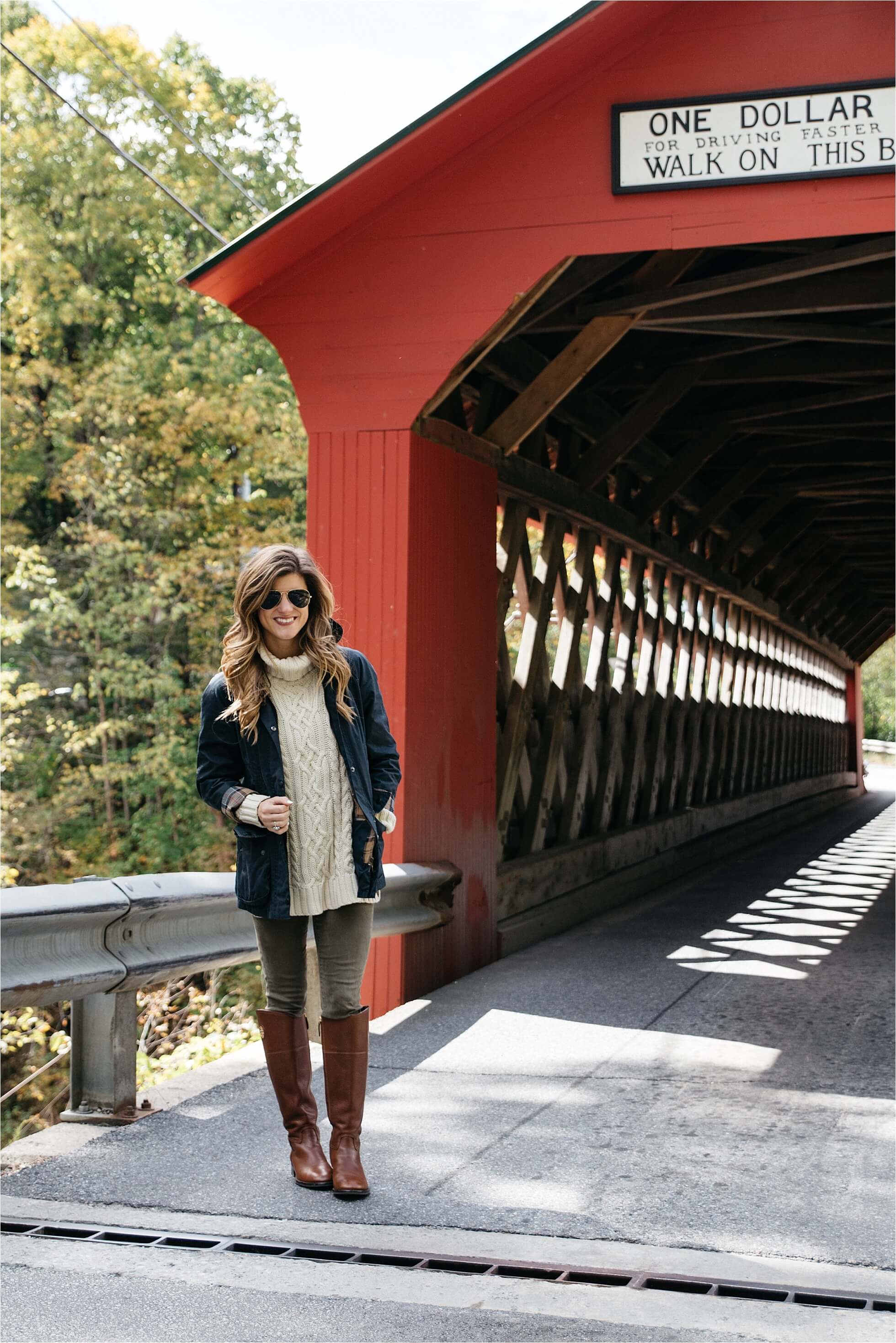 Fall outfit, tory burch riding boots, barbour jacket, olive green pants, oversized cableknit turtleneck sweater covered bridge in Vermont