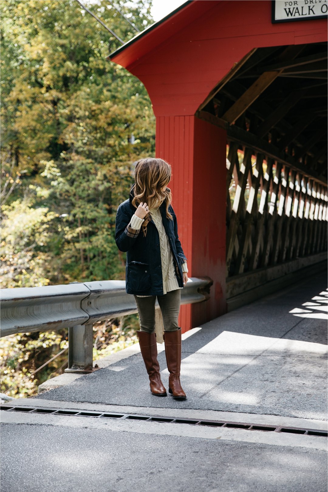 Fall outfit, tory burch riding boots, barbour jacket, olive green pants, oversized cableknit turtleneck sweater covered bridge in Vermont