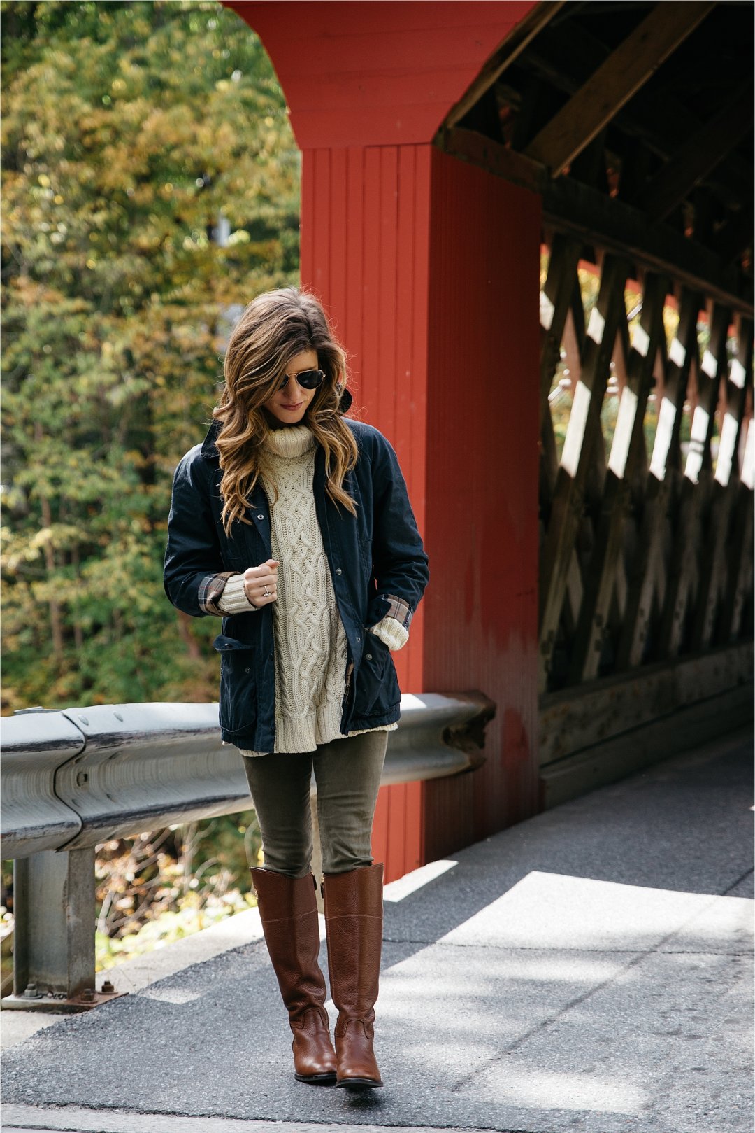 Fall outfit, tory burch riding boots, barbour jacket, olive green pants, oversized cableknit turtleneck sweater