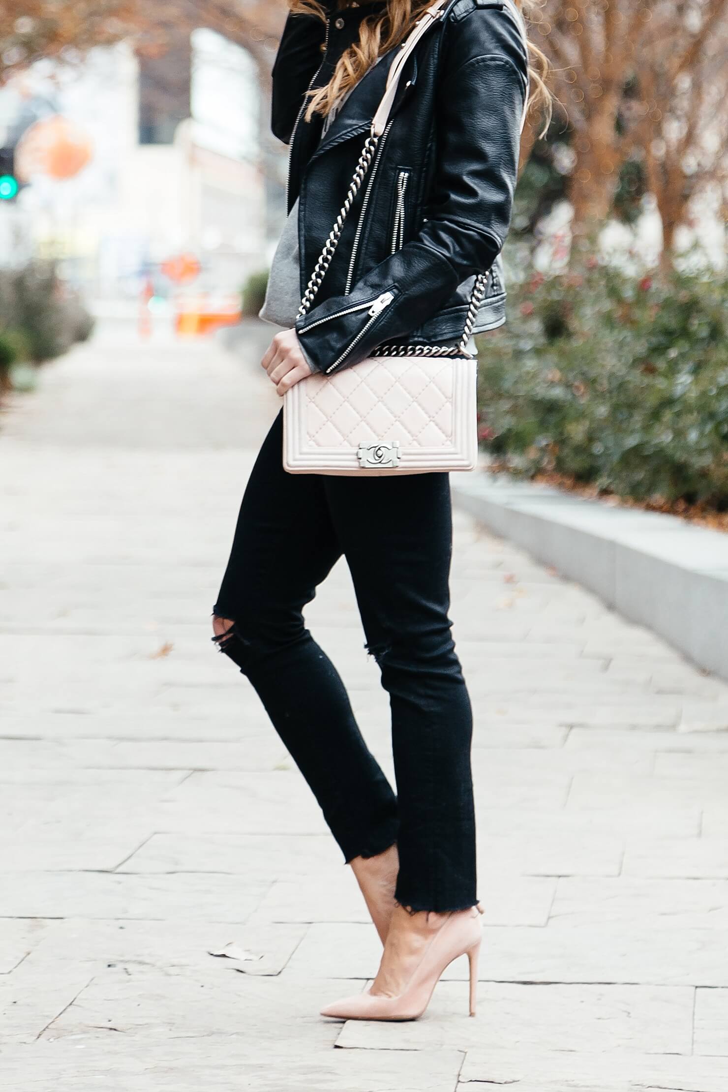 black distressed jeans and blush pumps and bag