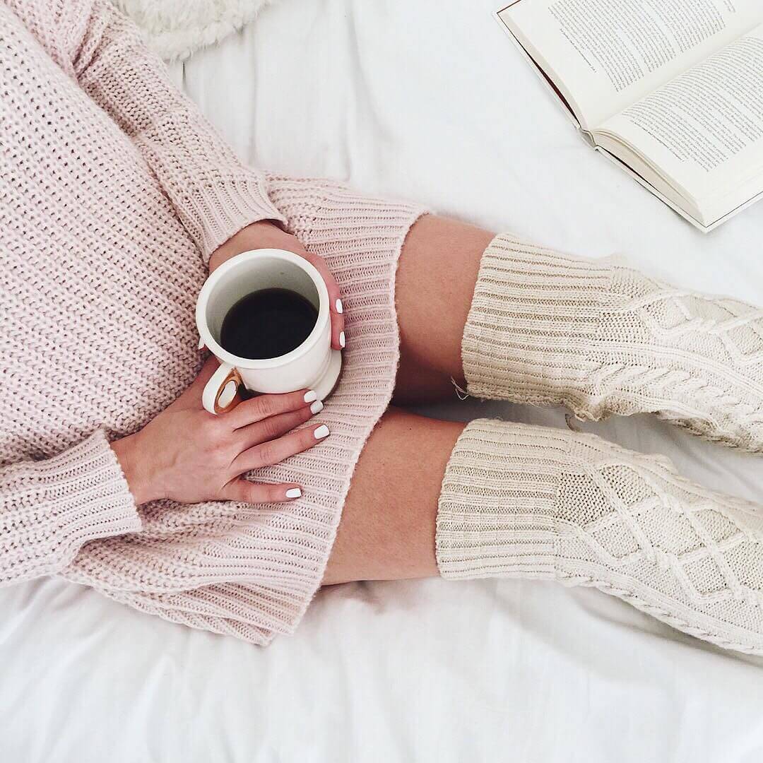 cozy outfit with pink sweater and long knee high knit socks 