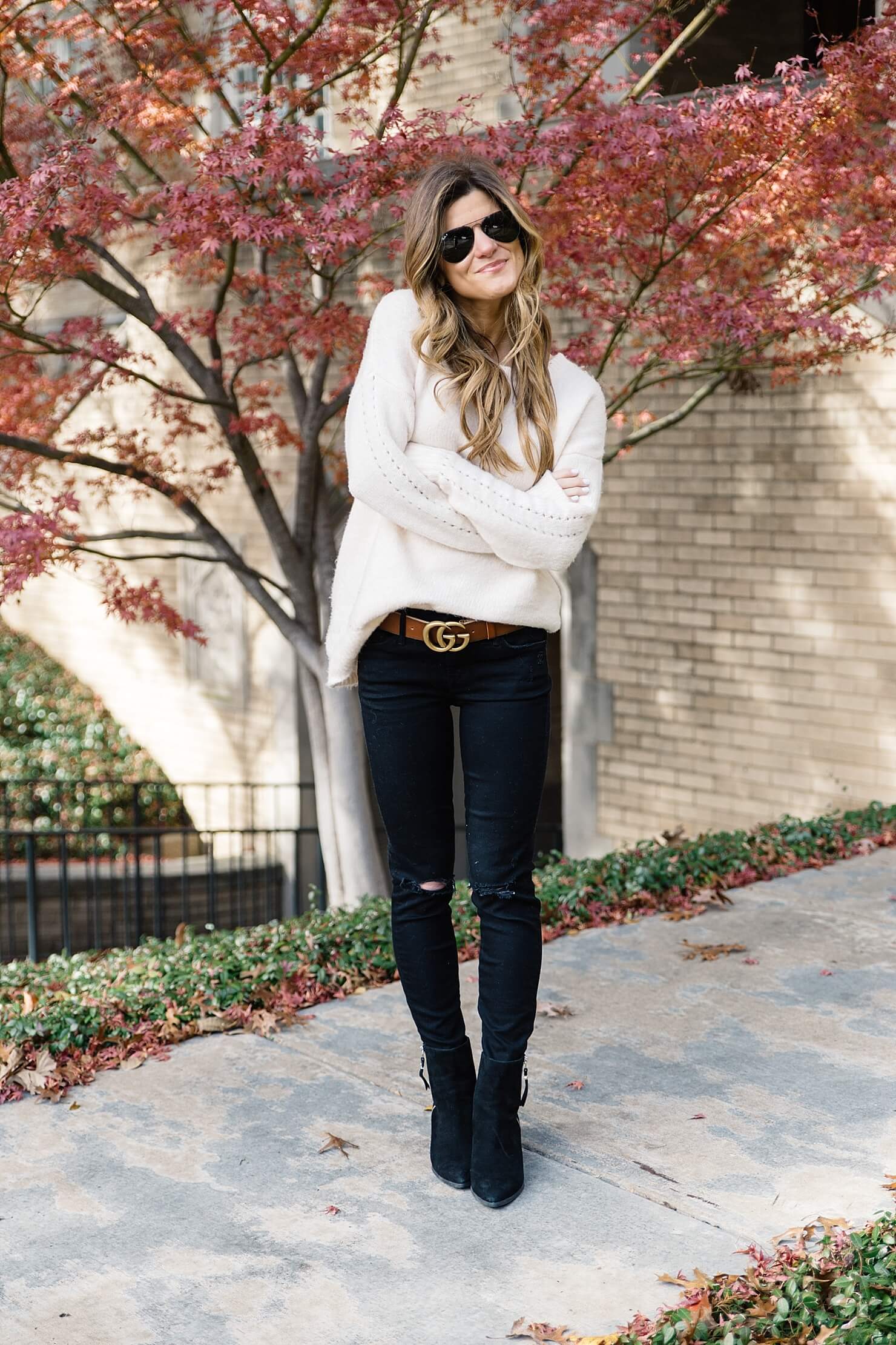 statement belt trend to try gucci brown logo belt, black jeans and black booties, brown belt with black jeans, oversized sweater with skinny jeans, casual fall outfit