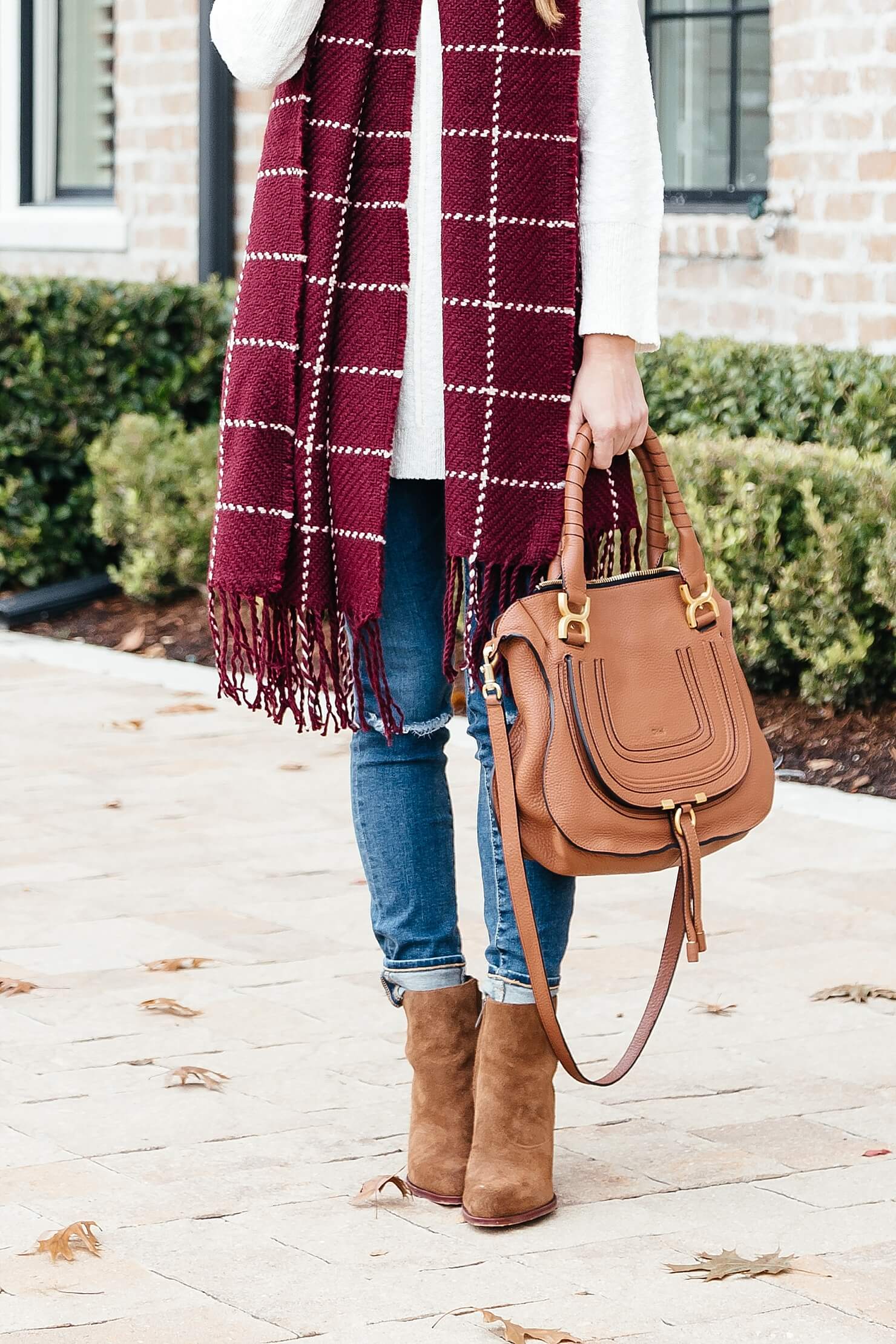 Fall outfit details, distressed AG jeans, sam edelman suede blake booties, cream tunic sweater, burgundy scarf