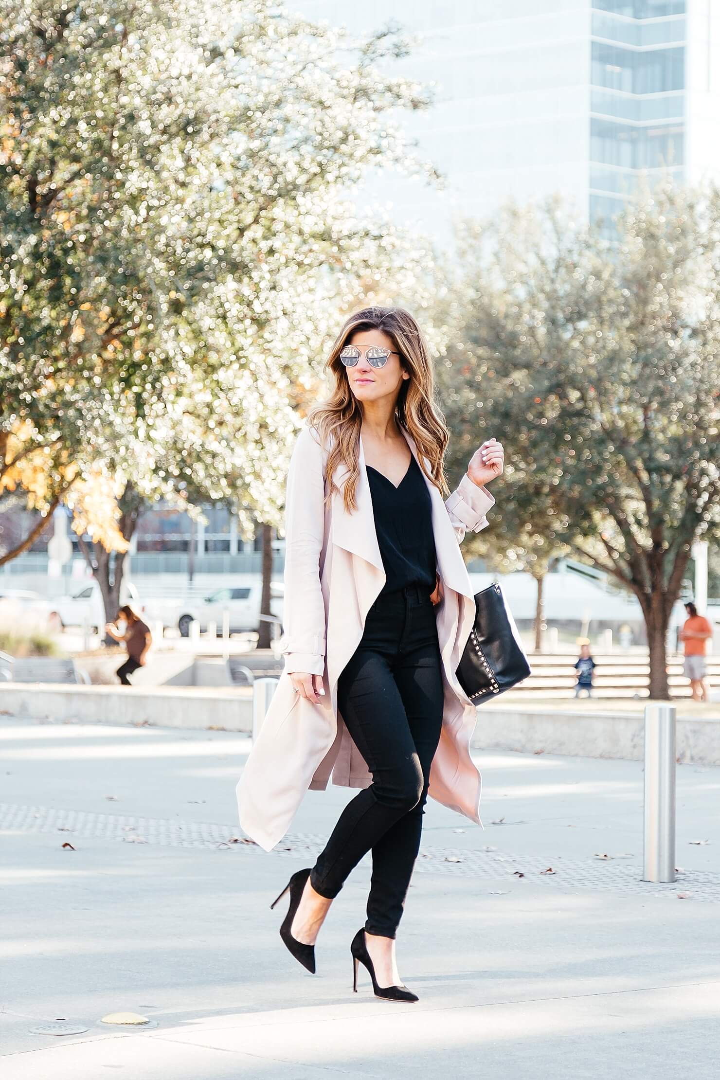 all black outfit, blush pink duster coat, pink trench coat, black on black going out look