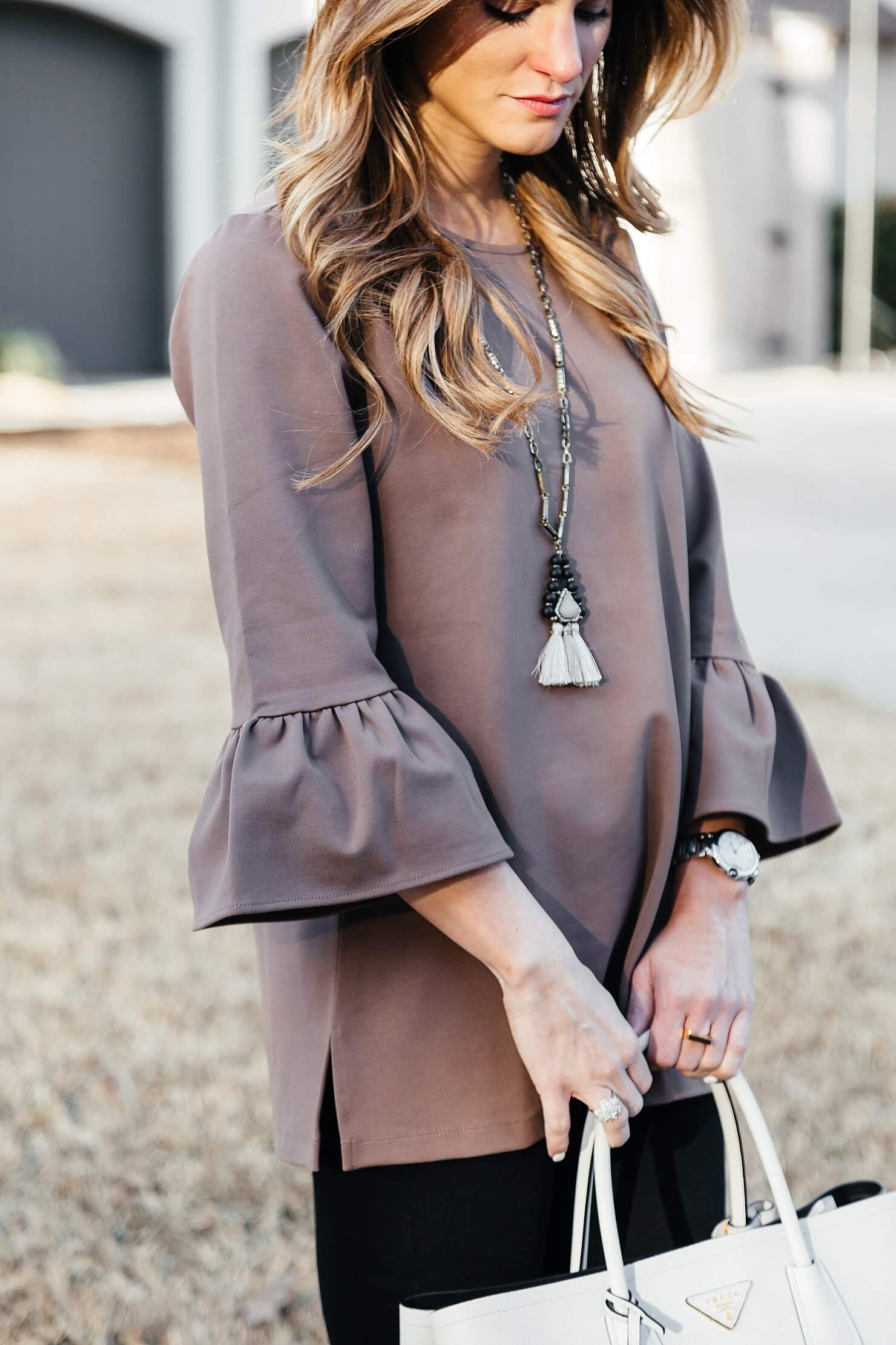 brighton the day peplum sleeve top with tassel necklace 