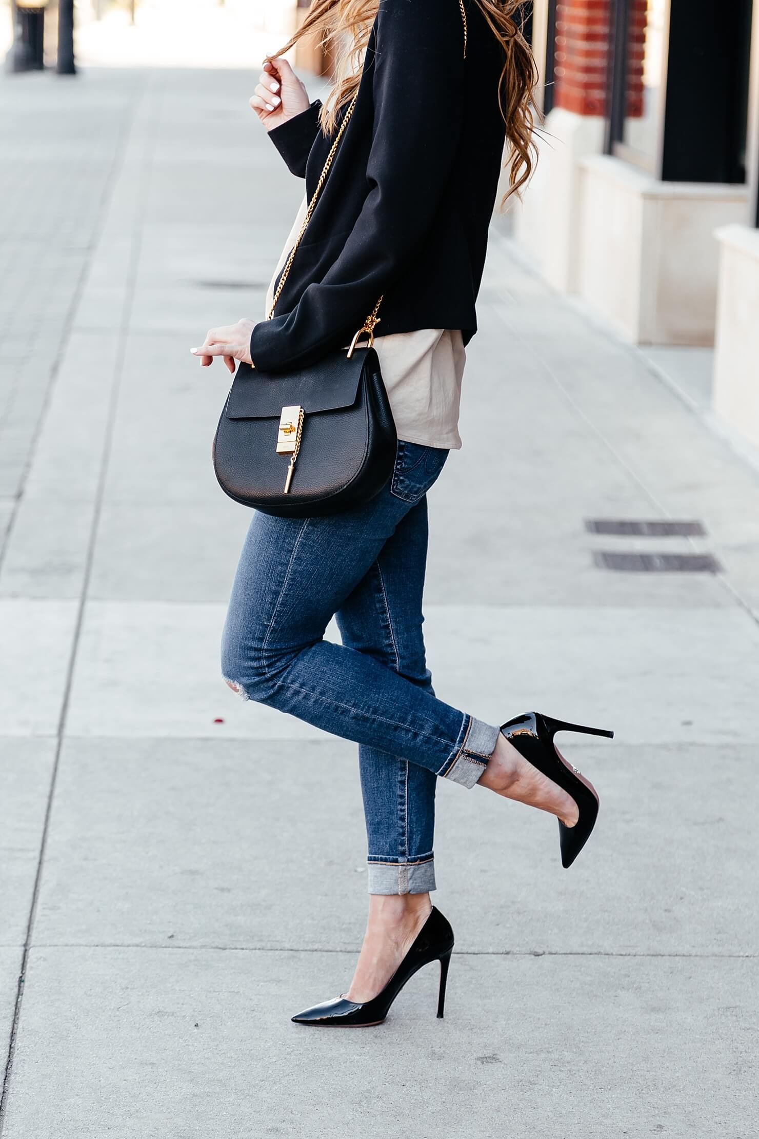 brighton keller styling prada patent pumps with jeans and black blazer and chloe small drew bag