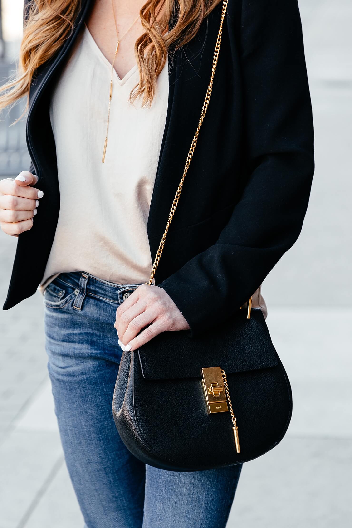 brighton keller styling jeans and black blazer with chloe small drew bag